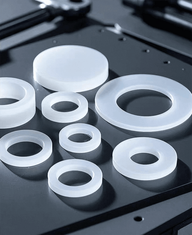 Custom-fabricated silicone and rubber parts including molded gaskets, extruded seals, and colorful grommets