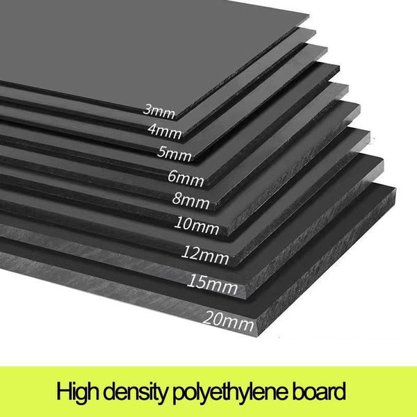 Cutting meat and vegetables on black HDPE board in kitchen